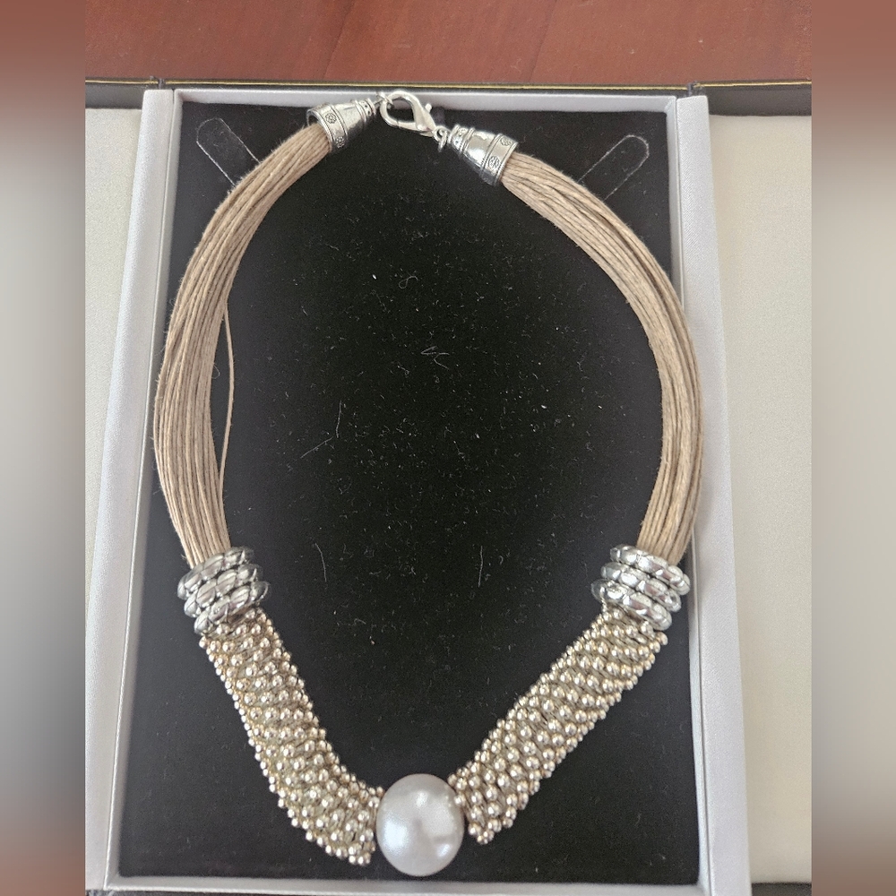Pretty statement 18" necklace has silver and pearl accents.